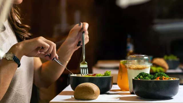 Person eating in restaurant