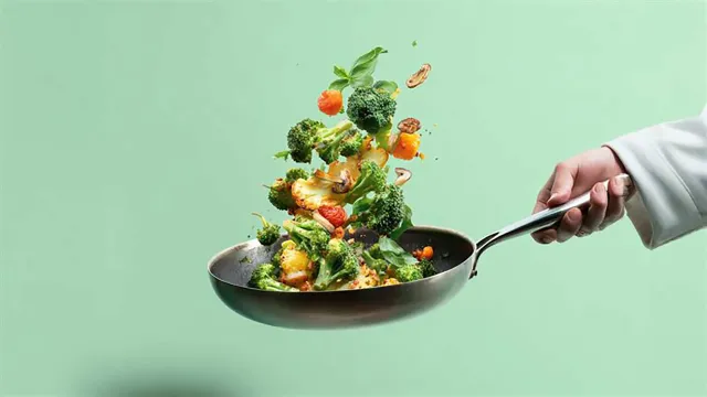 Vegetables being tossed in saute pan