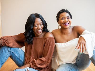 Two Black Women Smiling and Laughing Together