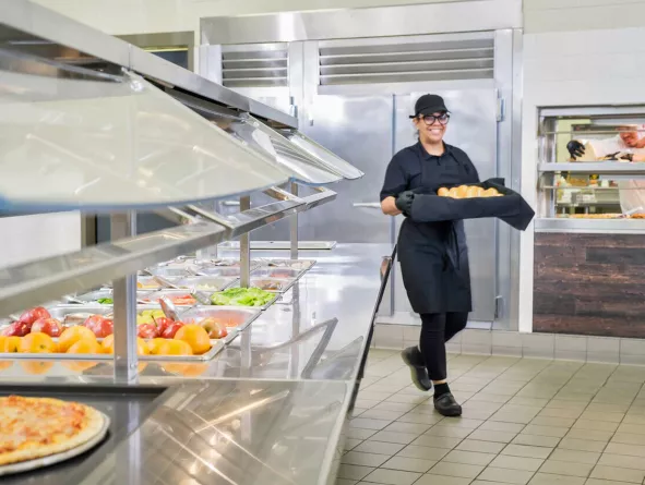 Cook bringing bread into server