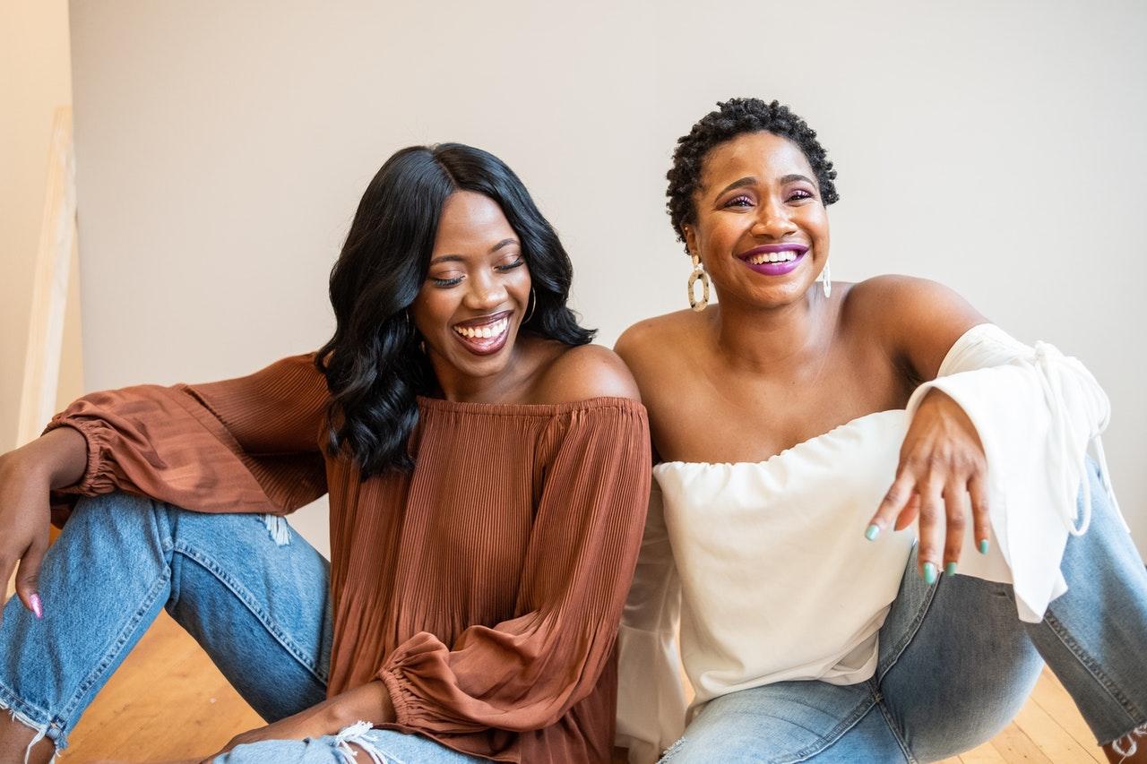 Two Black Women Smiling and Laughing Together