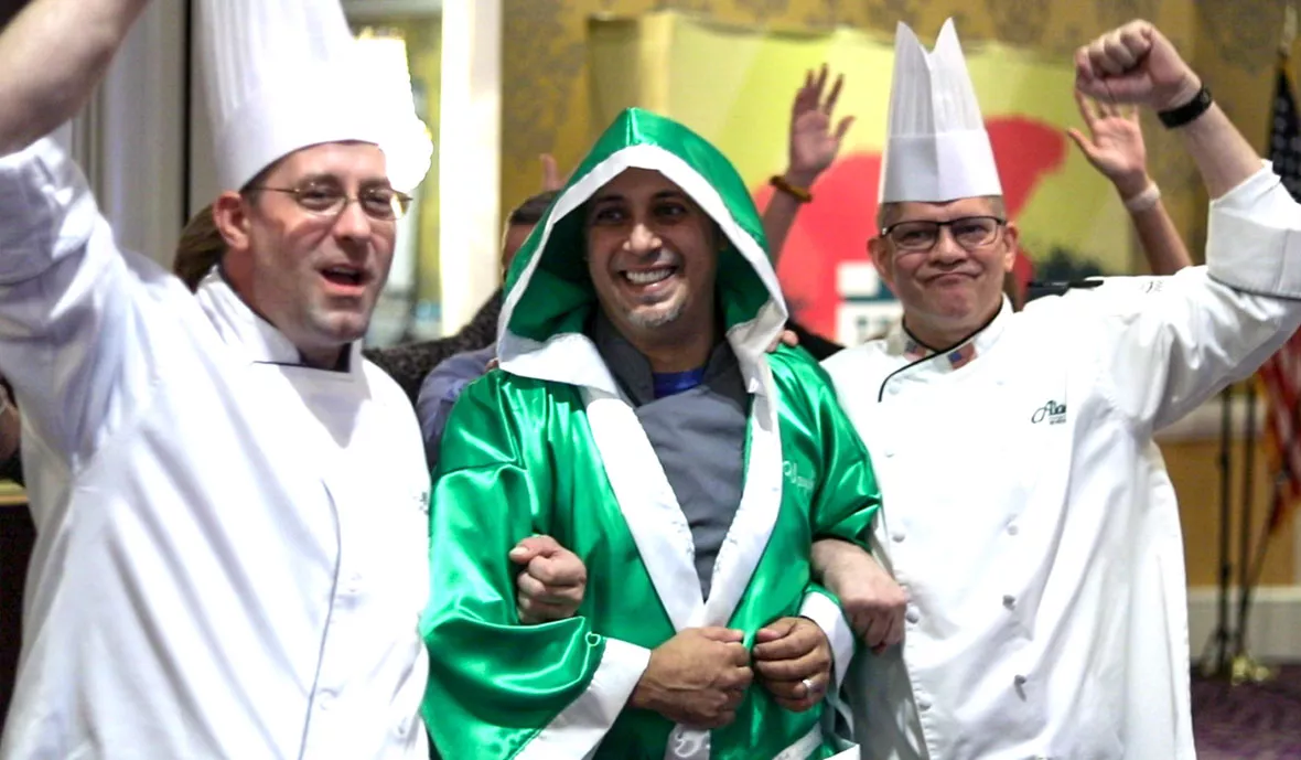 Chef Hector Ruiz walking in with Aladdin chefs