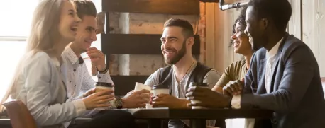 Group of young professionals sitting and drinking coffee